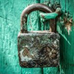 Rusty Padlock On Blue Door ALT